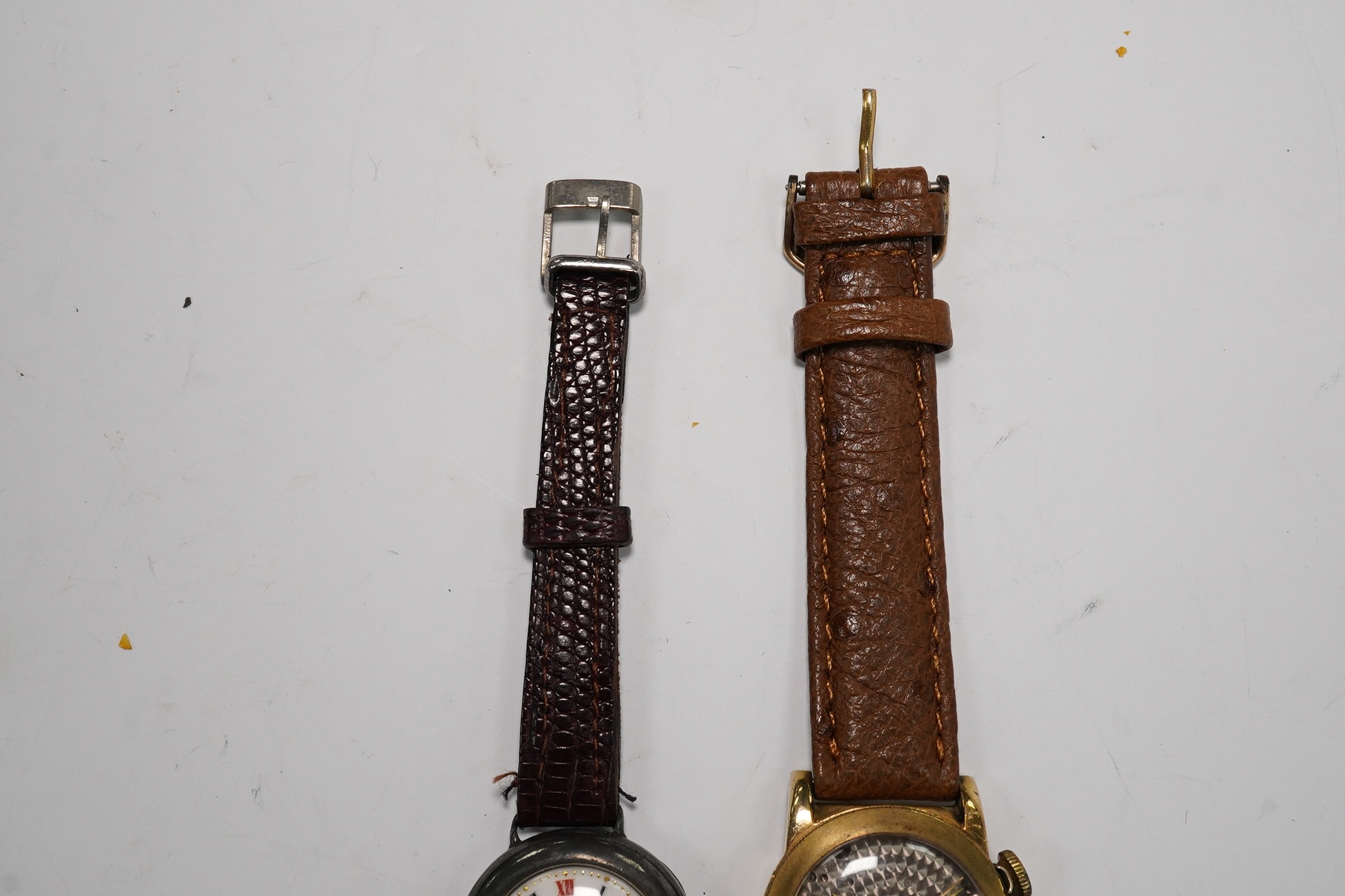A gentleman's 1940's 10k gold filled Longines Weems? manual wind wrist watch, lacking dial, case diameter 28mm, together with a lady's silver wrist watch. Condition - poor to fair